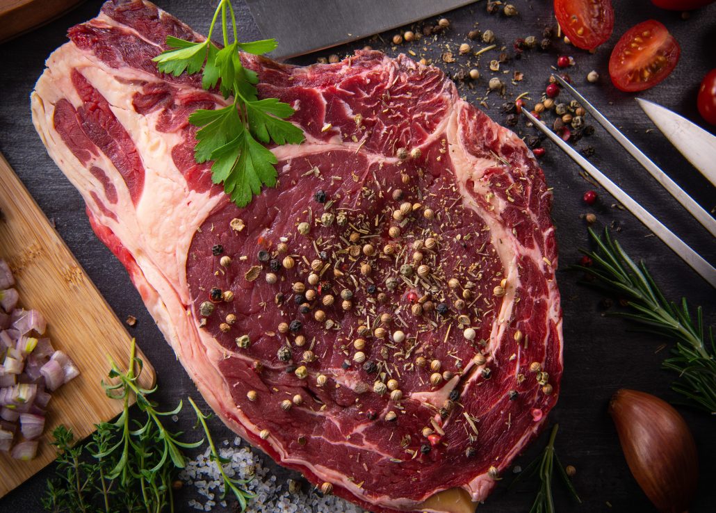 Raw T Bone steak entrecote prepared to Grill on turntable